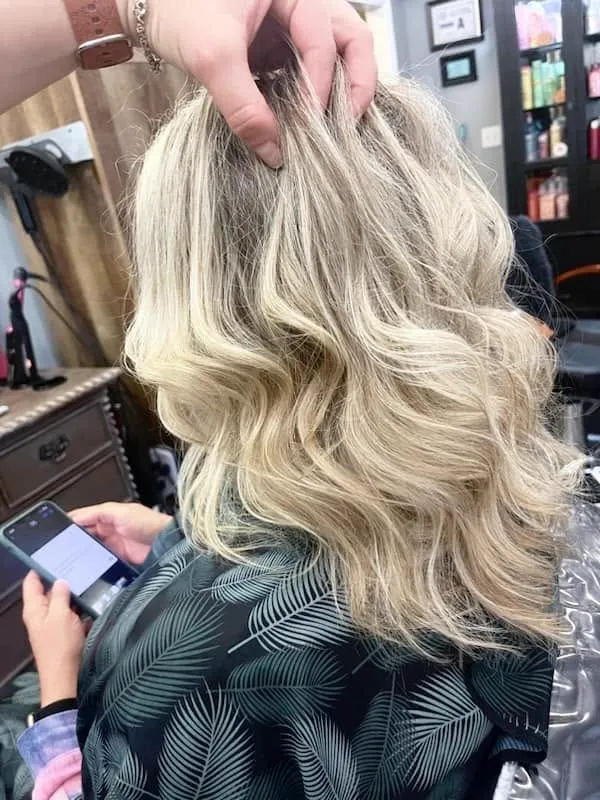 Loose blonde curls styled at the salon