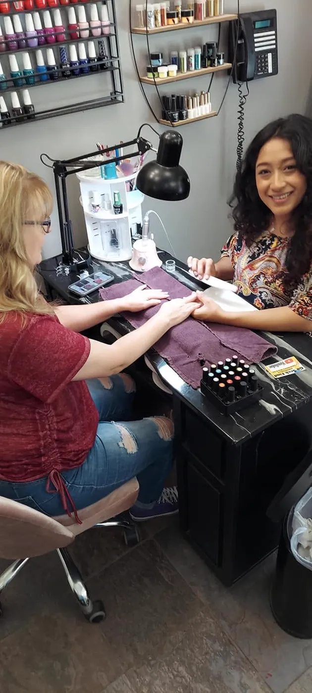 Manicure in progress at the Kozo nail table