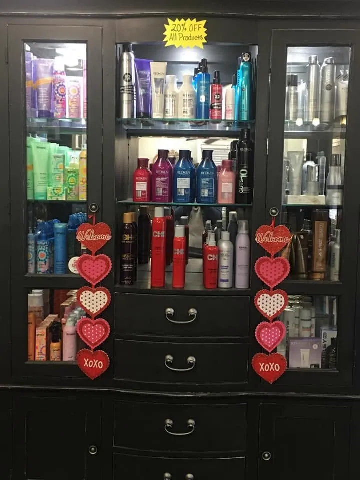 Professional hair products displayed in the salon retail cabinet
