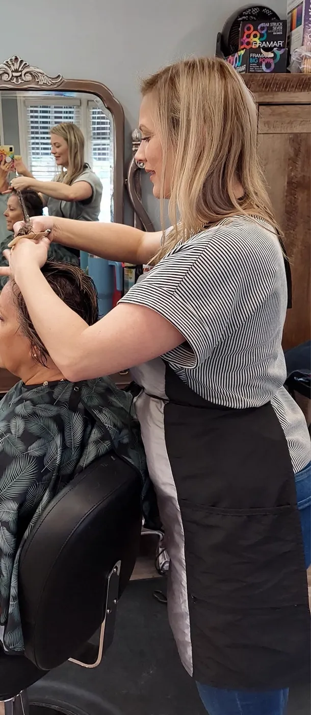 A Kozo stylist working through a color service with a client